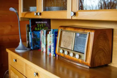 a wooden microwave sitting on top of a wooden table at Podjelje in Podjelje