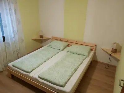 a pair of beds in a small room at apartma MAKS - Kobarid in Podbela