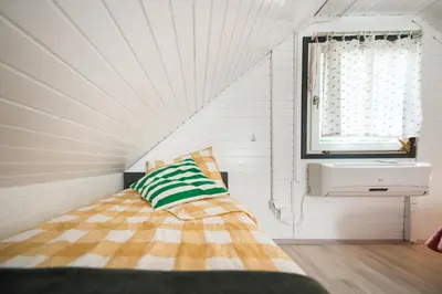 a bedroom with a bed and a window at Boho House 2 camp Terme Catez with promotional tickets prices in Čatež ob Savi