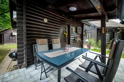 a blue table and chairs on a patio at Boho House 2 camp Terme Catez with promotional tickets prices in Čatež ob Savi