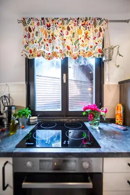 a kitchen with a stove and a window at Boho House 2 camp Terme Catez with promotional tickets prices in Čatež ob Savi