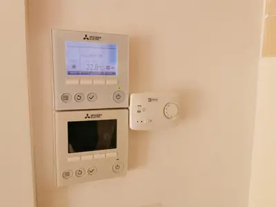 a room with a birth control machine on the wall at Cube studio by the river (with free bike rental) in Ljubljana