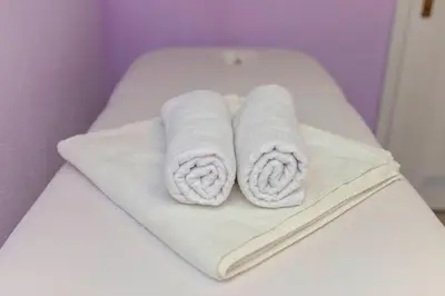 a couple of towels sitting on top of a bed at Apartment Pr' Kavač in Rateče