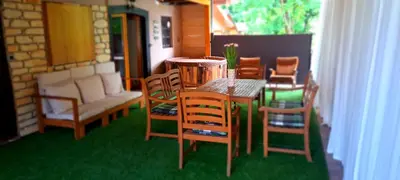 a room with a table and chairs and a couch at RIVER KOLPA APARTMENT, Griblje ob reki Kolpi in Gradac