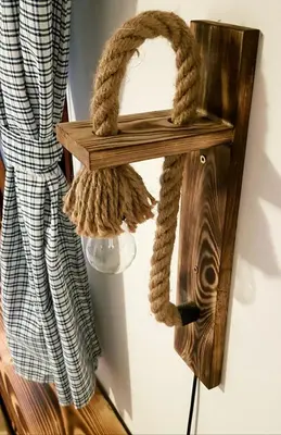 a wooden shelf with a rope hanging on a wall at RIVER KOLPA APARTMENT, Griblje ob reki Kolpi in Gradac