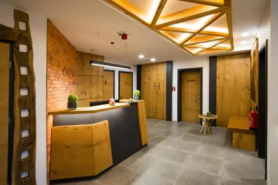 an office lobby with wood paneling and a reception counter at Pr Anzl in Bled