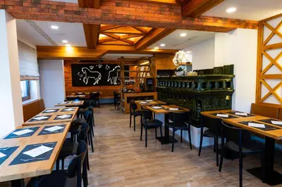 a dining room with wooden tables and chairs at Pr Anzl in Bled