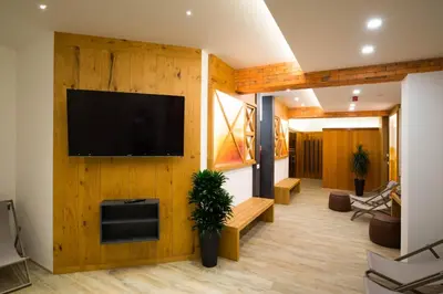 a living room with a flat screen tv on a wall at Pr Anzl in Bled