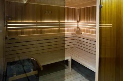 a sauna with a bench and a light in it at Pr Anzl in Bled