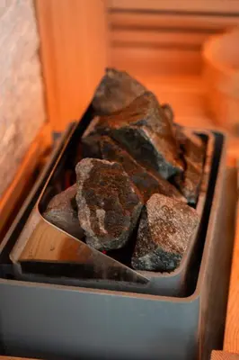 a pan full of rocks on a stove at 9b-The Resort in Sežana
