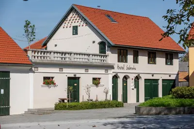 a white building with an orange roof at Hostel Gabronka in Bistrica ob Sotli