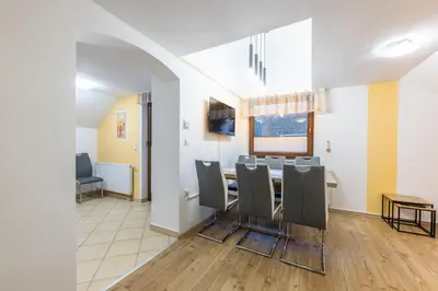 a dining room with a table and chairs at Apartment Eli in Kranjska Gora