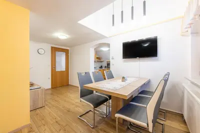 a dining room with a table and chairs at Apartment Eli in Kranjska Gora