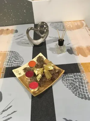 a plate of food with a gold bow on a table at Apartma Tjaša-Terme Čatež in Čatež ob Savi