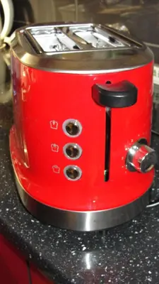a red toaster sitting on top of a counter at Apartma Tjaša-Terme Čatež in Čatež ob Savi