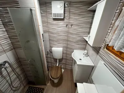 a small bathroom with a toilet and a sink at Apartma Tjaša-Terme Čatež in Čatež ob Savi