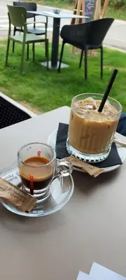 two cups of coffee sitting on a table at Apartments & Burgers REZIDENCA PIPANOVA in Ljubljana
