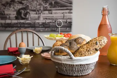 a basket of bread and eggs on a table at Fani&Rozi B&B in Maribor