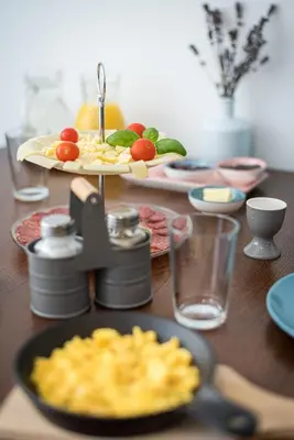 a table with a plate of food on a table at Fani&Rozi B&B in Maribor