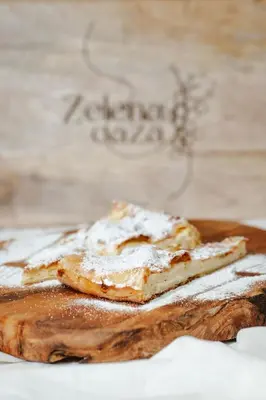 two pieces of bread on a wooden cutting board at Zelena Oaza - B&B in Miklavž pri Ormožu