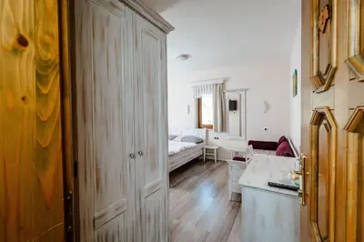 a room with a bedroom with a bed and a door at Zelena Oaza - B&B in Miklavž pri Ormožu