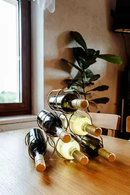 a bunch of wine bottles sitting on a table at Zelena Oaza - B&B in Miklavž pri Ormožu