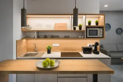 a kitchen with a bowl of fruit on a table at Vila Emona - Central Apartments - Free Parking in Ljubljana