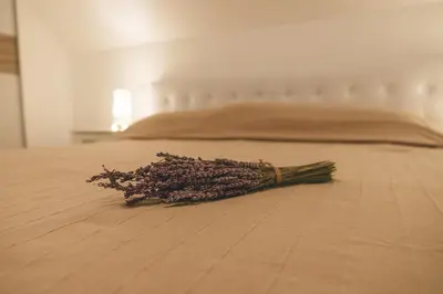 a pile of dried flowers laying on a bed at Villa Melody in Bohinj