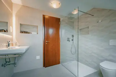 a bathroom with a shower and a toilet and a sink at Kala B&B in Kranjska Gora