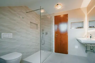 a bathroom with a shower and a toilet and a sink at Kala B&B in Kranjska Gora