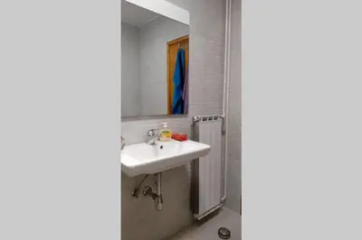 a bathroom with a sink and a mirror at ZRM center in Idrija