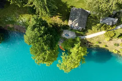 an aerial view of a house next to a lake at Private beach house on Lake Bled in Bled