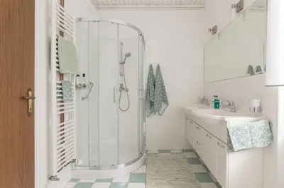 a bathroom with a shower and a sink at OPN Apartments Bled in Bled