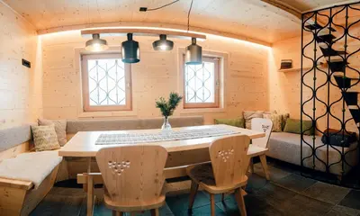 a dining room with a table and chairs at Chalet Lepenatka with Sauna - I feel Alps in Stahovica