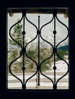 a window with a view of a snow covered mountain at Chalet Lepenatka with Sauna - I feel Alps in Stahovica