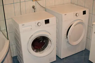 a washing machine and a washer in a bathroom at house on the top of the hill in Mozirje