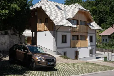 a car parked in front of a house at Apartments Janko in Bled
