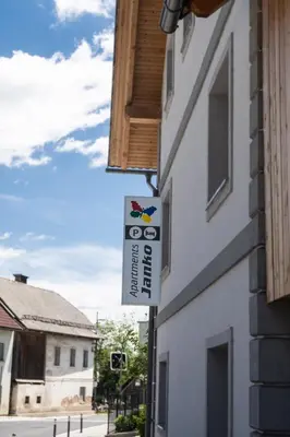 a sign on the side of a building at Apartments Janko in Bled