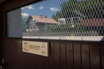 a window in a building with a sign on it at Apartments Janko in Bled