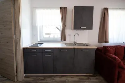 a kitchen with a sink and a window at Apartments Janko in Bled