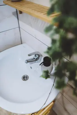 a bathroom sink with a faucet on top of it at Gorska Roža in Log pod Mangartom