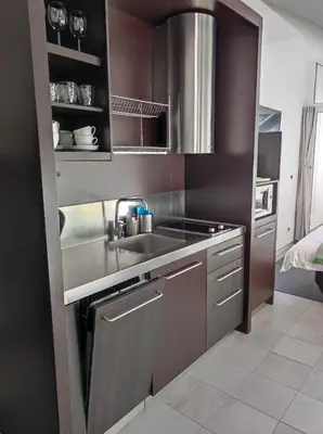 a small kitchen with a sink and a stove at Apartment Klara in Kranjska Gora