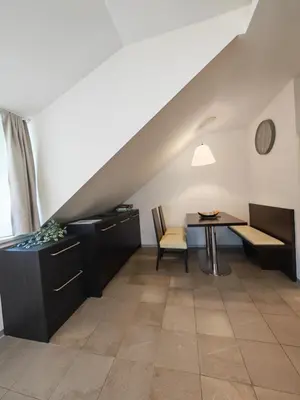 a living room with a table and a dining room at Apartment Klara in Kranjska Gora