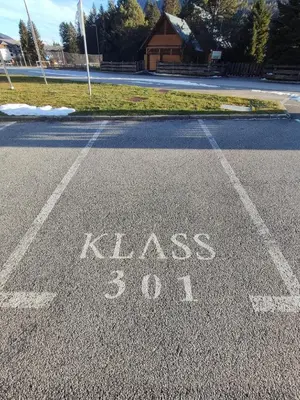 a street with the words kiss written on the road at Apartment Klara in Kranjska Gora