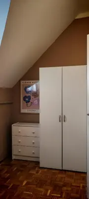 a room with two white cabinets and a dresser at Apartma Julija Hiška 59 in Čatež ob Savi