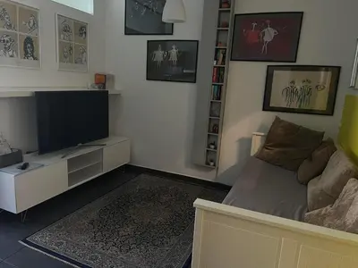 a living room with a couch and a flat screen tv at Park in Ljubljana
