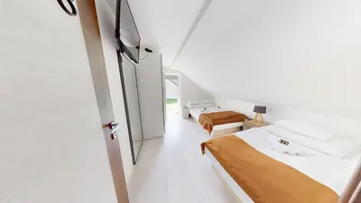 a small room with two beds and a window at Villa Four Stars ART-PE in Trebnje