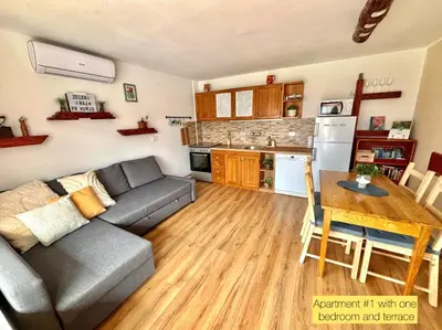 a living room with a couch and a table at Hurja Apartments in Kobarid