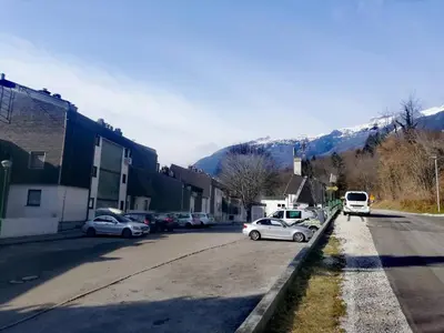 a street with cars parked on the side of the road at Alpine Relax Bovec in Bovec
