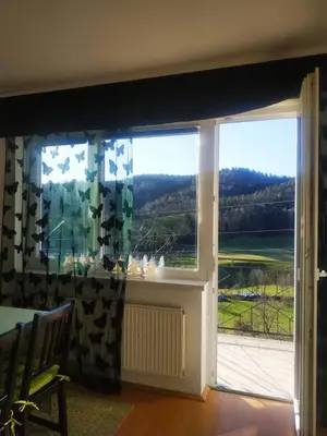 a window with a view of a green field at Apartmaji Sofia in Maribor